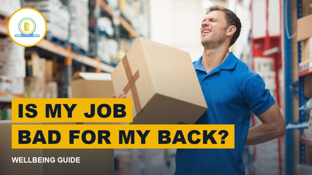 Warehouse worker holding his lower back while carrying a box